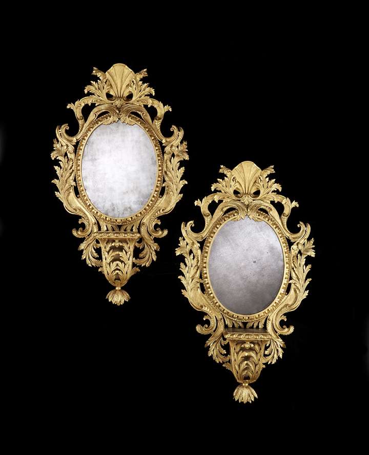 A pair of giltwood mirrors with brackets